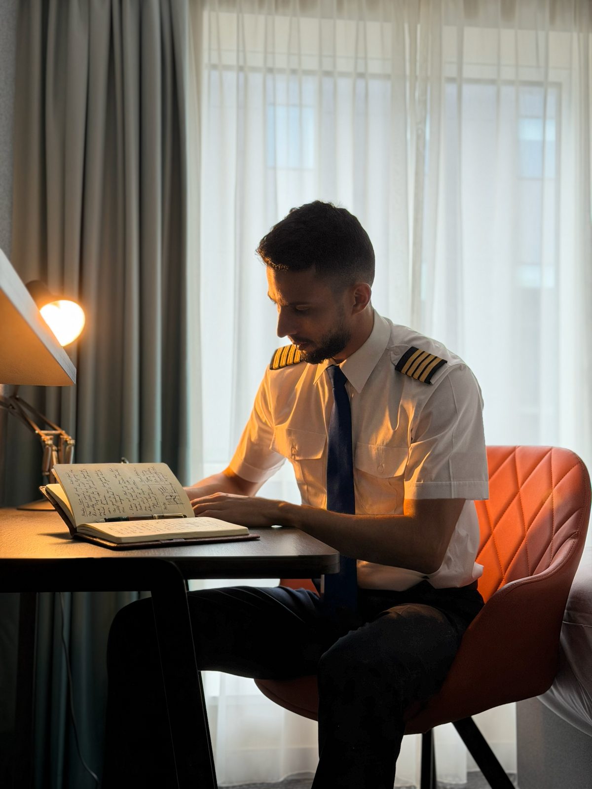 Capt. Yassine in uniform at a desk